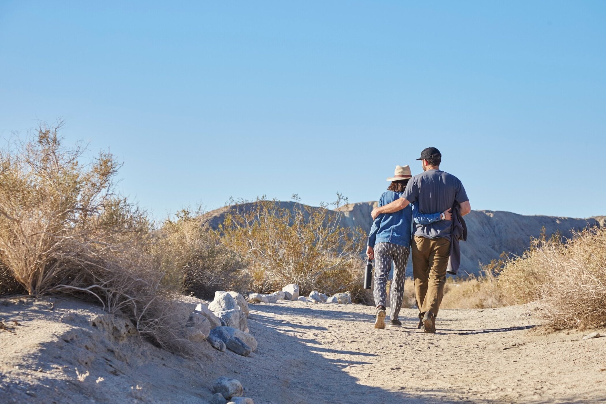 Happy couple hiking through the desert near Palm Springs California